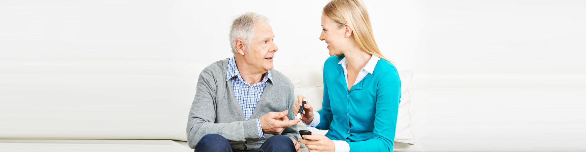 nurse and elderly person talking